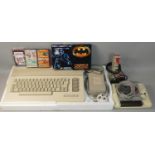 A boxed Commodore 64 ?Playful Intelligence? pack, with PSU, joystick, television lead and games to