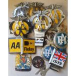 Six winged AA car bumper badges, a Lambretta badge and other badges.