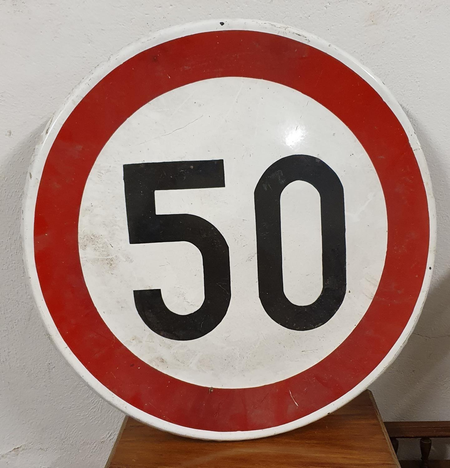 A single sided enamel speed limit sign, 50 and another 40, with post mounting brackets, 60cm.