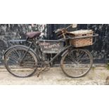 A BSA delivery bicycle, with three speed gears and rod brakes, wicker basket, sign written Scuffy