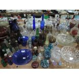 A selection of glass wares including bottles figures and candle sticks