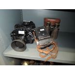 A selection of cameras including Canon A-1 35 mm and old binoculars