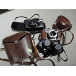 Yashica Minister camera, a Chinon Multi AF camera and a pair of Swift Apollo 8x30 binoculars