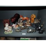 A selection of figures and figurines including stone carved hippos