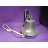 A brass or similar cast school or factory bell