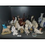 A selection of figures and figurines including art deco polar bears and Royal Dux deer