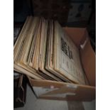 A box of mixed LP records