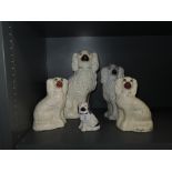 A selection of flat back Staffordshire figures of dogs and spaniels