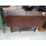 A 19th century mahogany drop leaf table of vernacular design having drop leaf top on square