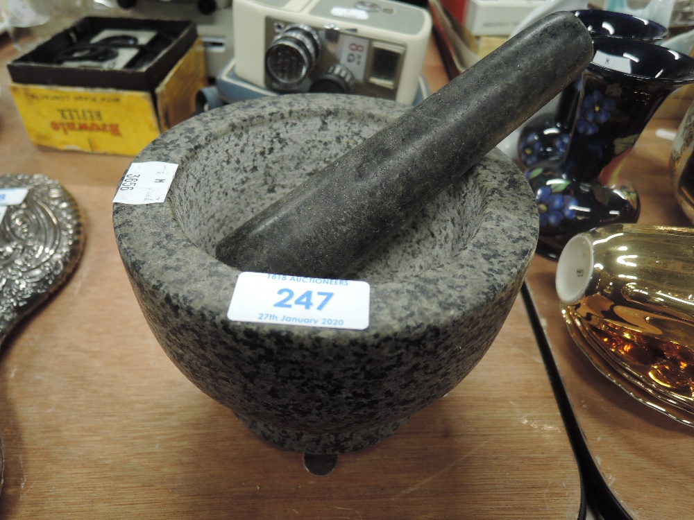 A stone carved mortar and pestle