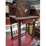 An early 20th century oak hall table in the Art Deco style having drawer and shelf and an early 20th