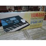A Yamaha PSR 185 keyboard, boxed