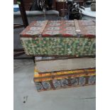 Three vintage tin trunk, decorated with drinks labels