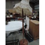 An oriental style carved standard lamp