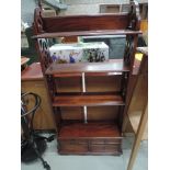 A modern mahogany small shelf unit