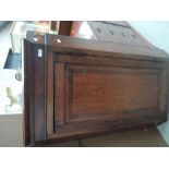 An early 19th century oak corner wall cupboard having crossband panel door