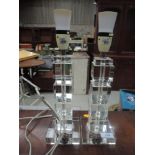 A pair of modern glass table lamps