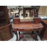 A mid Victorian mahogany Duchess dressing table having oval mirror with jewellery drawers, frieze