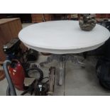 A painted pedestal dining table