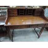 A mid to late 20th Century oak open top desk