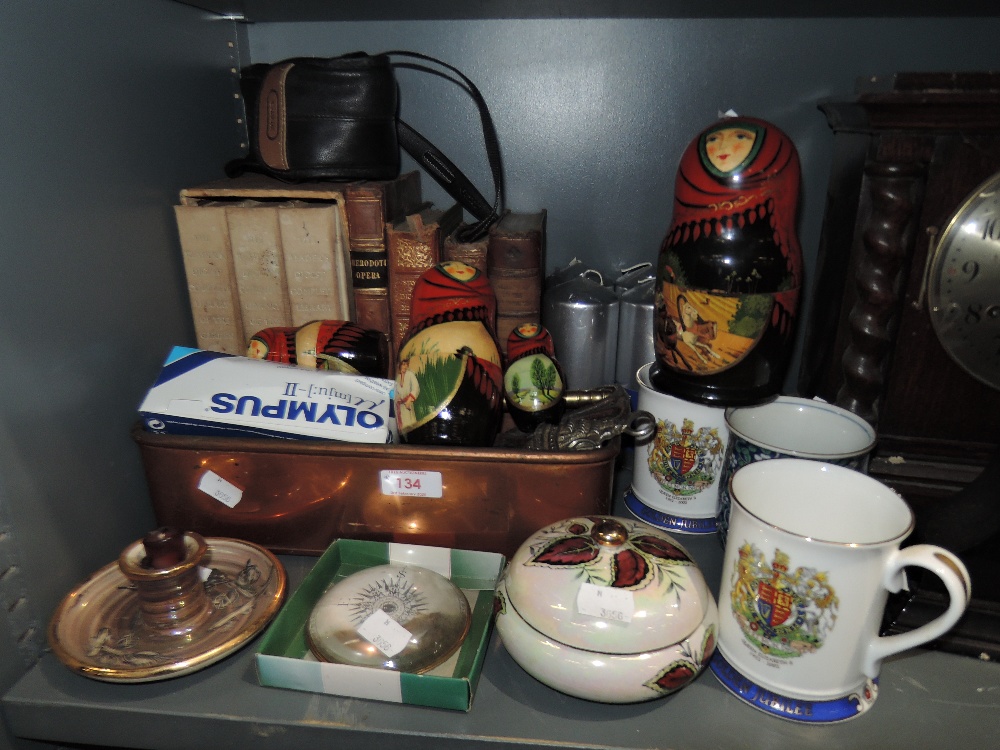 A selection of ceramics and antique books including Russian Doll set