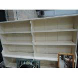 A set of traditional painted shelves with panelled back