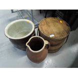 A selection of earthenware pots and similar wooden container