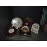 A selection of mantle clocks including enamel faced