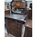 An early 20th Century oak dressing chest