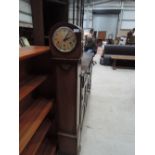 An early 20th Century oak grandmother clock