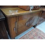 An early to mid 20th Century oak sideboard in the Art Deco style with double semi fitted cupboard