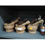 A selection of wooden turned mortar and pestle