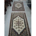 A pair of fireside rugs