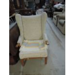 An upholstered wing back chair