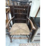 A traditional spindle back carver chair