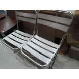 Two aluminium folding chairs