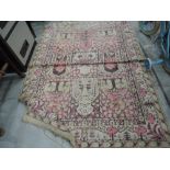 A vintage beige and pink fireside rug