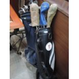 Two sets of golf clubs in bags