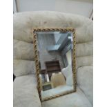 A gilt frame wall mirror