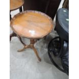 A reproduction occasional wine table , having shaped edge`