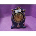 An antique European design hard paste enamel faced mantle clock