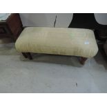 A modern upholstered footstool