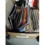 A selection of vinyl albums and theatre programmes