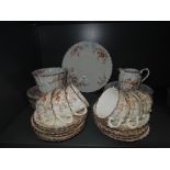 A part tea service with hand painted decoration