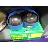 A set of Drakes pride Lawn bowls