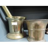 A vintage large brass pestle and mortar, of traditional form and a copper and brass mortar