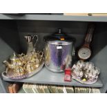 A fine selection of plated serving items including champagne bucket, tea service, claret jug and