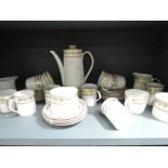 A part tea and coffee service by Elizabethan in the Swiss cottage design