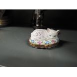 A ceramic trinket case by Limoges hand decorated and designed as a cat in a basket