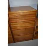 A vintage teak bedroom chest of four drawers